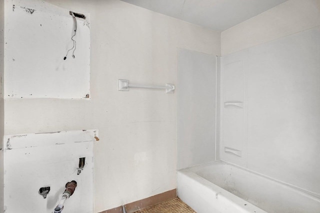 bathroom featuring a tub and tile patterned flooring