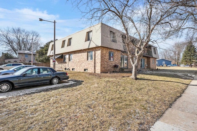 view of home's exterior featuring a yard