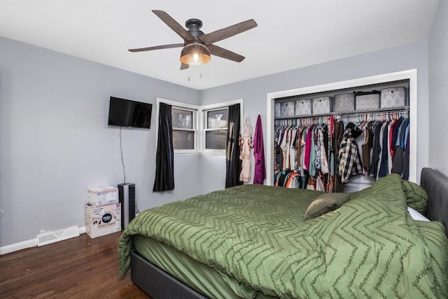 bedroom featuring hardwood / wood-style flooring, ceiling fan, and a closet