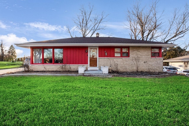 ranch-style house with a front lawn