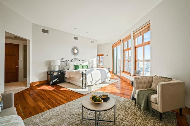 bedroom with hardwood / wood-style floors