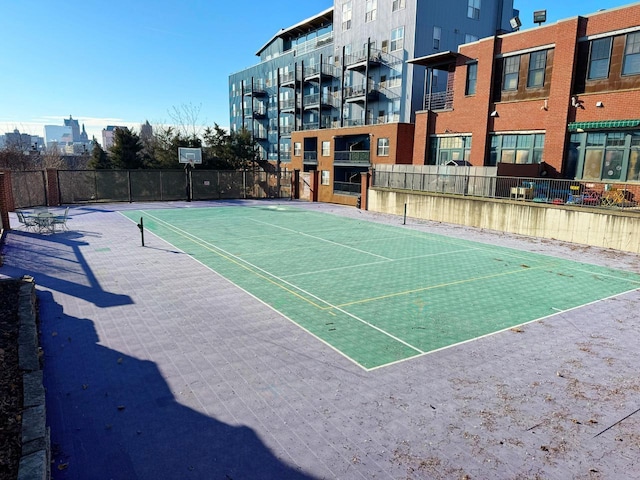 view of sport court featuring basketball hoop