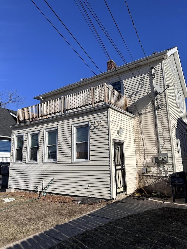 view of property exterior featuring a balcony