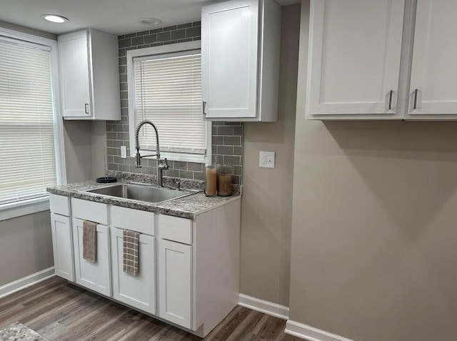 kitchen with white cabinets and sink