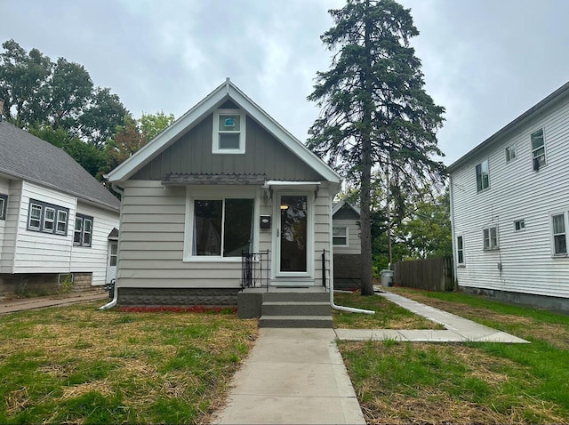 bungalow with a front yard