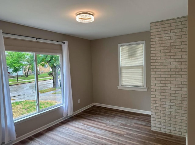 empty room with hardwood / wood-style floors