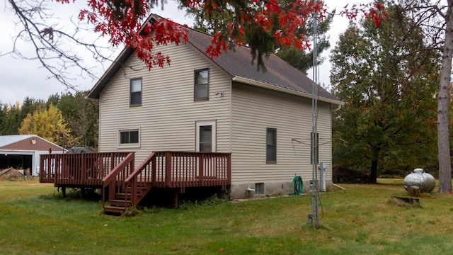 back of property with a lawn and a wooden deck