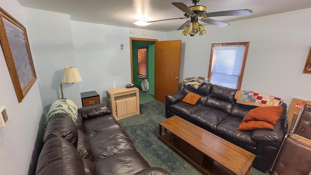 carpeted living room with ceiling fan