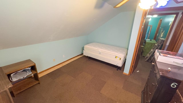 bedroom with ceiling fan and lofted ceiling