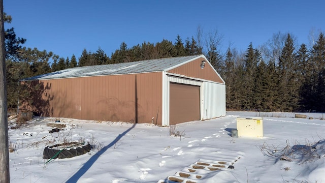 view of snow covered garage