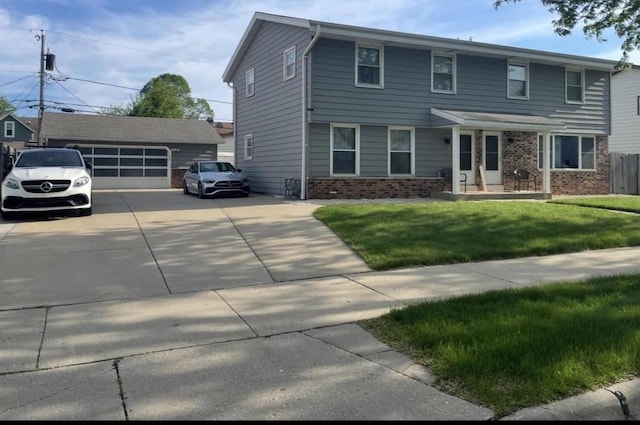 view of front facade with a garage, an outdoor structure, and a front lawn