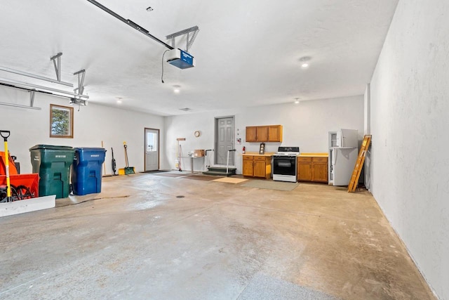 garage featuring fridge and a garage door opener