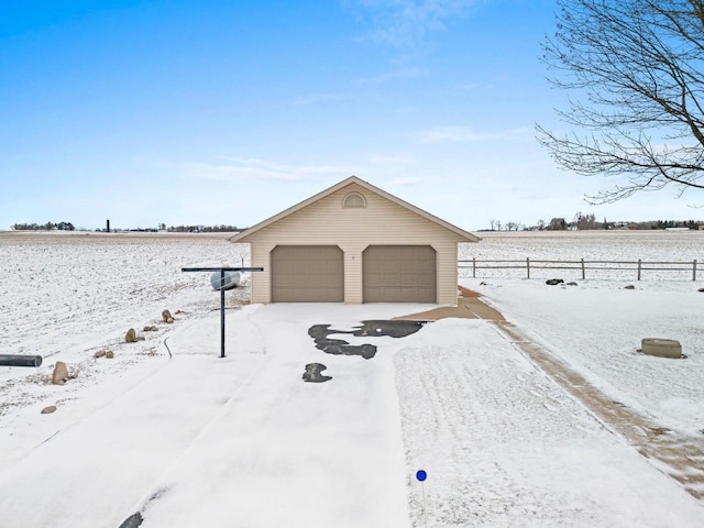 exterior space with a garage and an outdoor structure