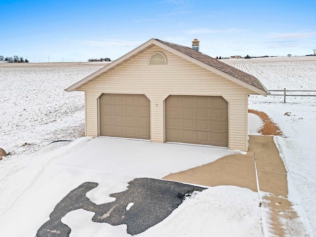 view of snow covered garage