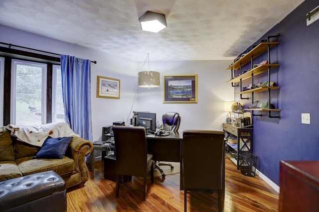 office space featuring hardwood / wood-style floors and a textured ceiling