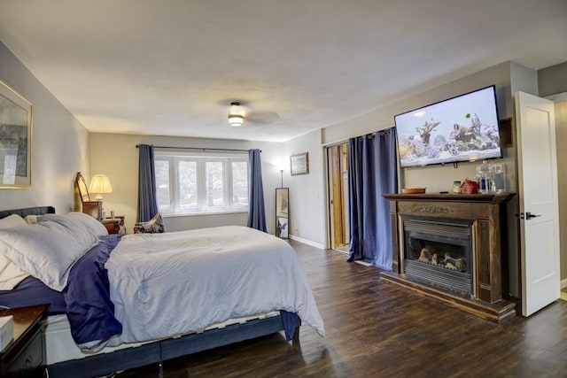 bedroom with ceiling fan and dark hardwood / wood-style floors