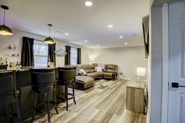 interior space featuring pendant lighting and light wood-type flooring