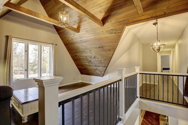 corridor with vaulted ceiling with beams, wood ceiling, a notable chandelier, and dark hardwood / wood-style floors