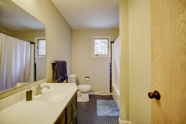 bathroom with toilet and vanity