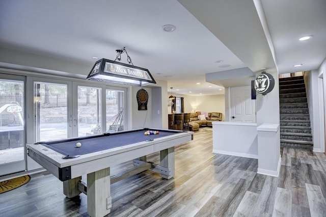 game room featuring billiards, french doors, and hardwood / wood-style floors