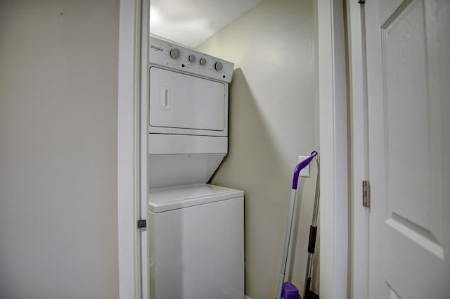 washroom with stacked washer and dryer