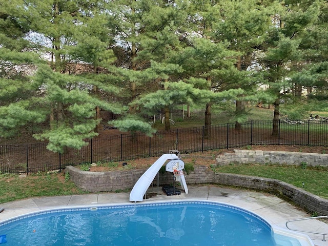 view of swimming pool featuring a water slide