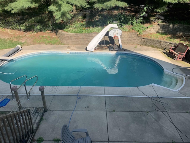 view of swimming pool featuring a water slide