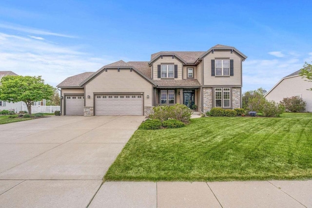 view of front of home featuring a front lawn and a garage