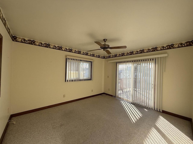 empty room with ceiling fan and carpet floors