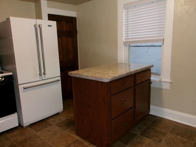 kitchen featuring high end white fridge