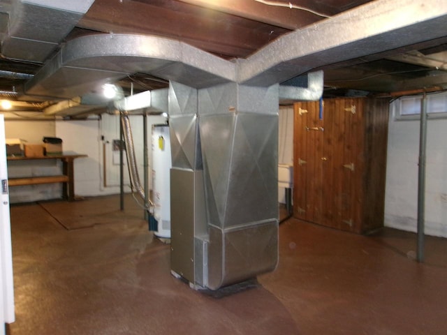 basement featuring heating unit and gas water heater