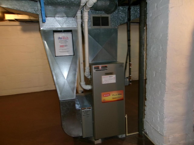 utility room with heating unit