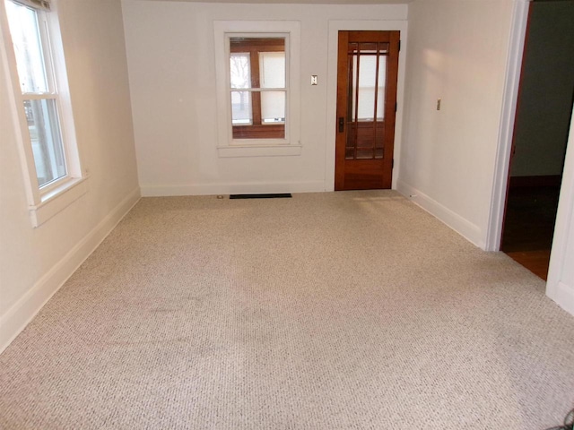 unfurnished room with carpet floors