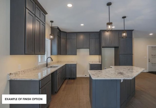 kitchen featuring hanging light fixtures, dark hardwood / wood-style flooring, and a center island