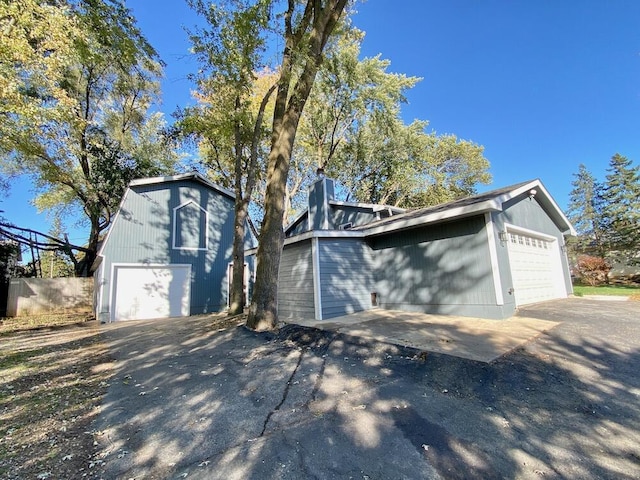 view of front facade with a garage and an outdoor structure