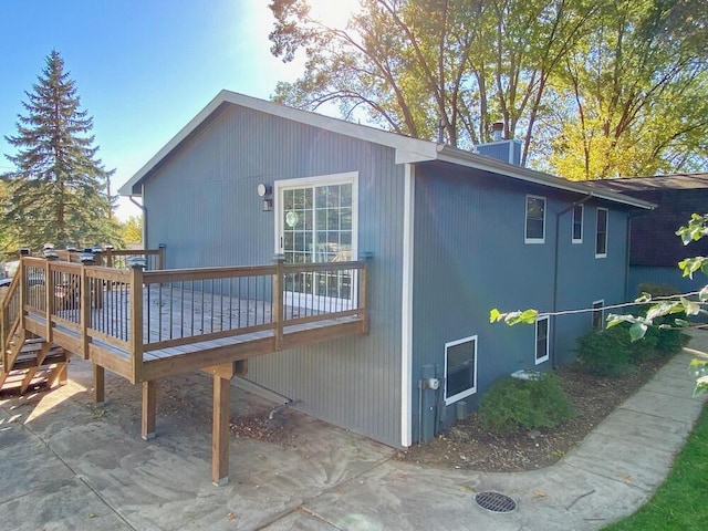 rear view of property with a wooden deck