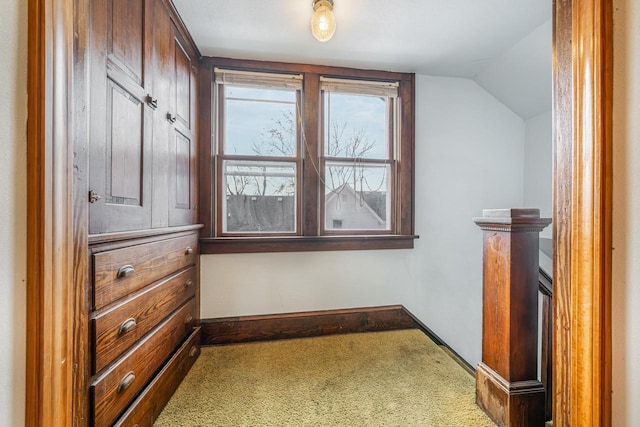 interior space featuring carpet and lofted ceiling