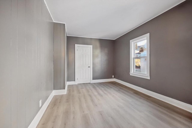 empty room with light hardwood / wood-style floors