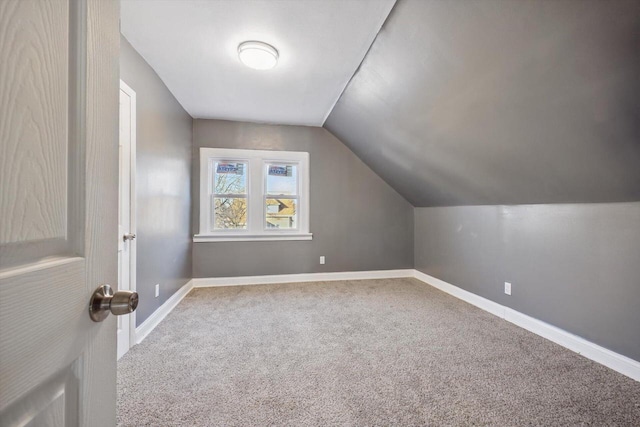 bonus room featuring carpet and lofted ceiling