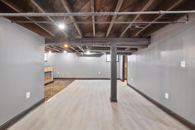 basement featuring hardwood / wood-style floors