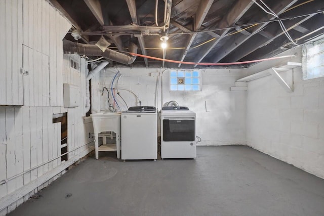 basement with a wealth of natural light and washing machine and dryer