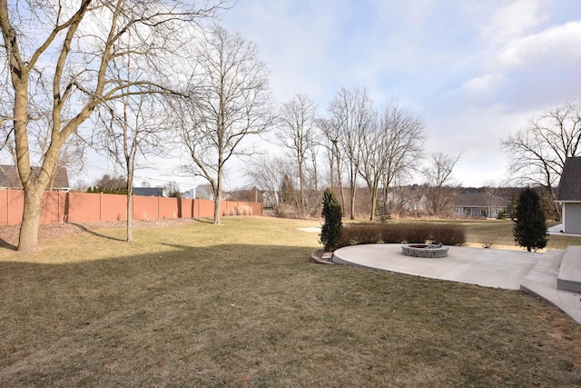 view of yard with a patio area and an outdoor fire pit