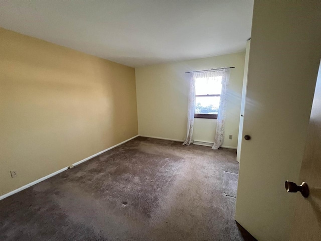 spare room featuring carpet