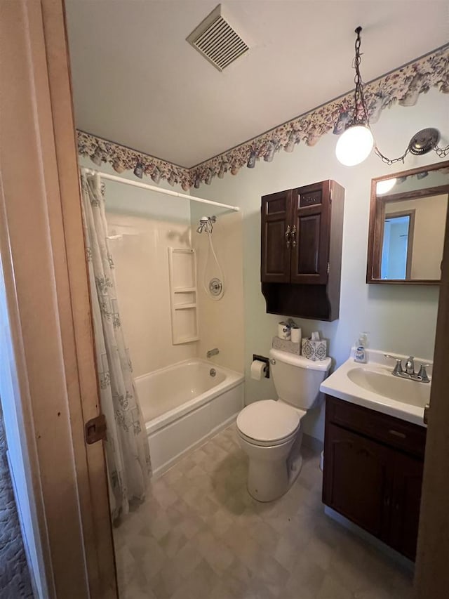 full bathroom featuring toilet, vanity, and shower / tub combo with curtain
