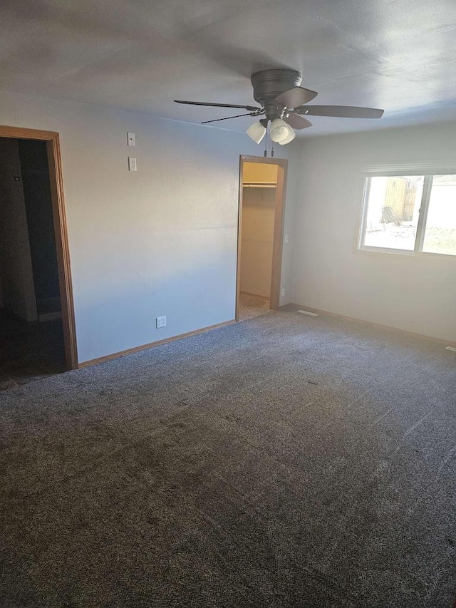 carpeted empty room with ceiling fan