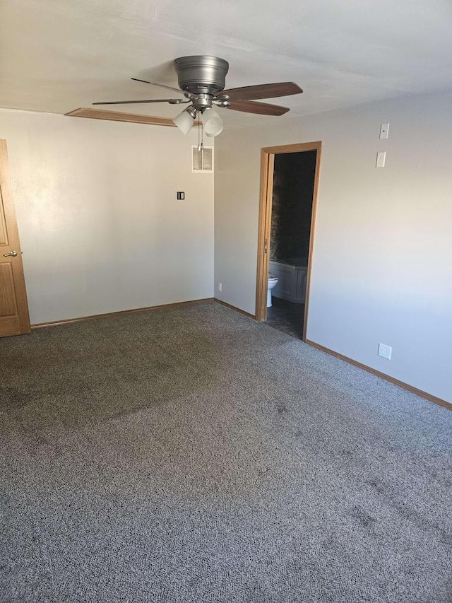 empty room with ceiling fan and carpet floors