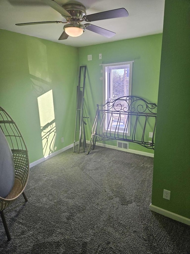 unfurnished bedroom featuring ceiling fan and carpet floors