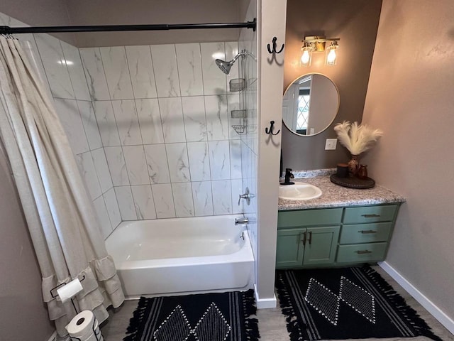 bathroom featuring shower / tub combo and vanity