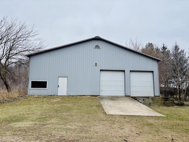 garage with a yard