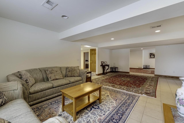 living area featuring light tile patterned floors, recessed lighting, visible vents, and baseboards